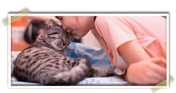 Girl cuddling with her cat